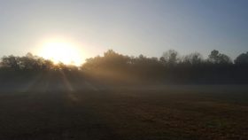 sunrise dispelling darkness